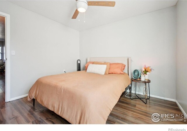 3431 Stover St Unit E-513, Fort Collins, CO 80525 - bedroom featuring wood finished floors, baseboards, and a ceiling fan