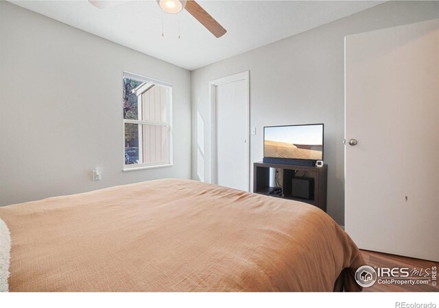 3431 Stover St Unit E-513, Fort Collins, CO 80525 - bedroom with a ceiling fan and wood finished floors
