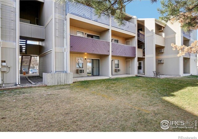 3431 Stover St Unit E-513, Fort Collins, CO 80525 - view of apartment building / complex with a wall unit AC and cooling unit
