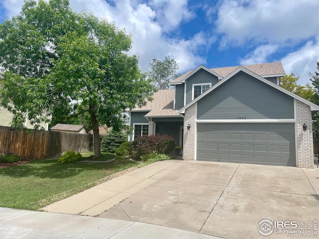 1202 Creekwood Ct, Windsor, CO 80550 - view of front of home featuring brick siding, a garage, concrete driveway, and a shingled roof
