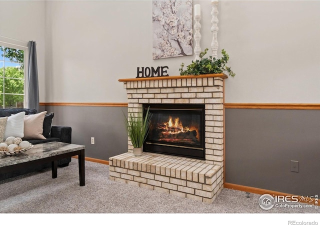 1202 Creekwood Ct, Windsor, CO 80550 - carpeted living room with a fireplace and baseboards
