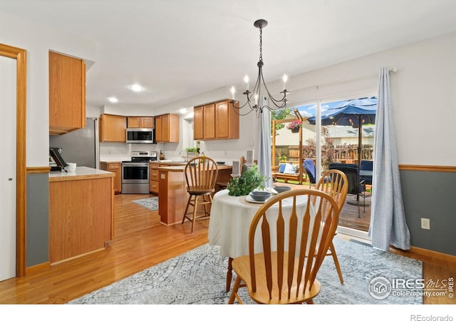 1202 Creekwood Ct, Windsor, CO 80550 - dining space with a chandelier, light wood-type flooring, and recessed lighting