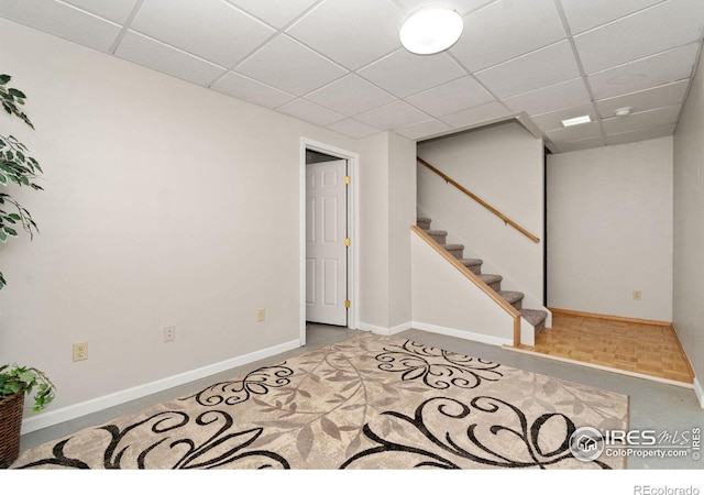 1202 Creekwood Ct, Windsor, CO 80550 - finished below grade area with a drop ceiling, baseboards, stairs, and carpet floors