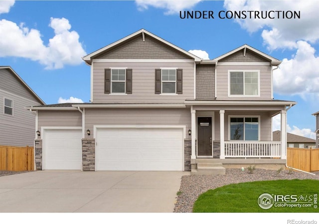 6300 Globeflower St, Wellington, CO 80549 - craftsman-style home featuring covered porch, driveway, stone siding, and a garage