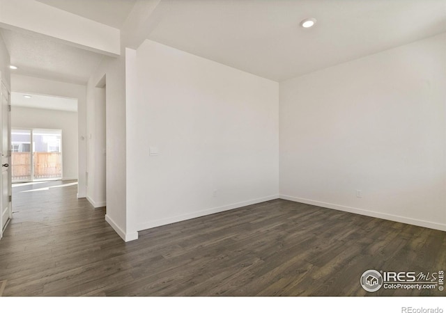 6300 Globeflower St, Wellington, CO 80549 - empty room featuring dark wood-type flooring, recessed lighting, and baseboards