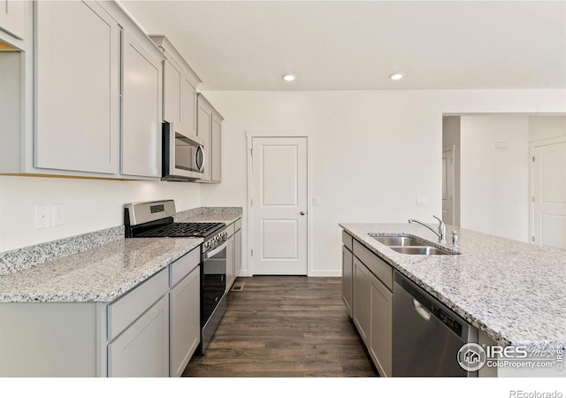 6300 Globeflower St, Wellington, CO 80549 - kitchen featuring appliances with stainless steel finishes, a sink, gray cabinetry, recessed lighting, and dark wood-type flooring