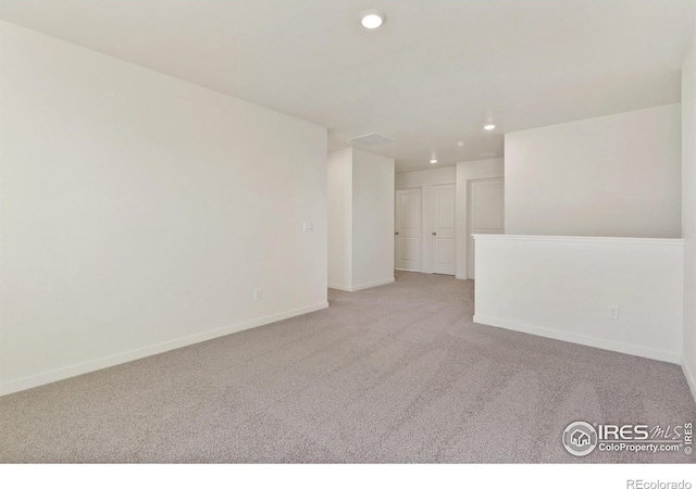 6300 Globeflower St, Wellington, CO 80549 - spare room featuring light colored carpet, recessed lighting, and baseboards