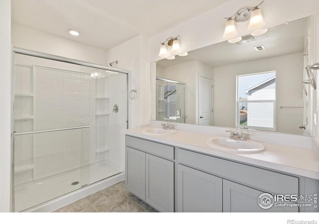 6300 Globeflower St, Wellington, CO 80549 - bathroom with double vanity and a stall shower
