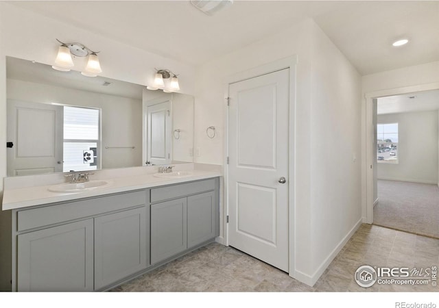 6300 Globeflower St, Wellington, CO 80549 - bathroom with double vanity and baseboards