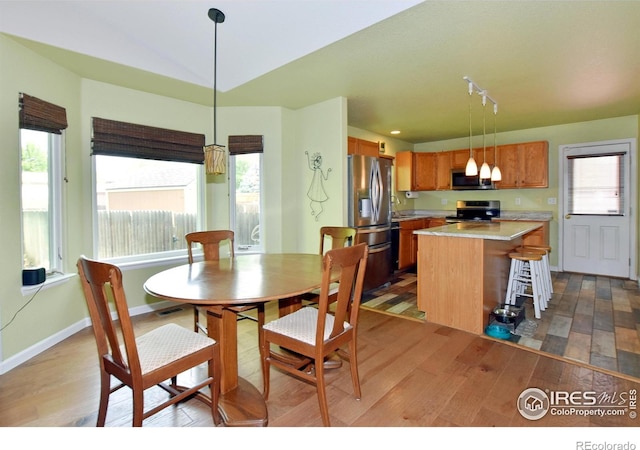 1131 Sandra Dr, Johnstown, CO 80534 - dining area with wood-type flooring and baseboards