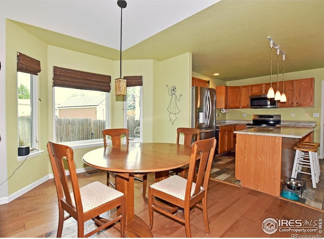 1131 Sandra Dr, Johnstown, CO 80534 - dining area with light wood finished floors and baseboards