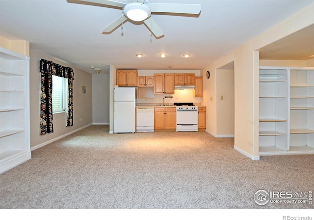 1131 Sandra Dr, Johnstown, CO 80534 - kitchen featuring white appliances, light carpet, baseboards, and a sink
