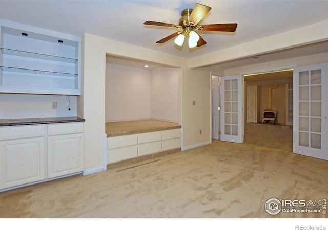 1131 Sandra Dr, Johnstown, CO 80534 - unfurnished bedroom with french doors and light colored carpet