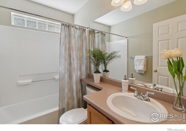 4725 Spyglass Dr, Broomfield, CO 80023 - bathroom featuring vanity, shower / bathtub combination with curtain, and toilet