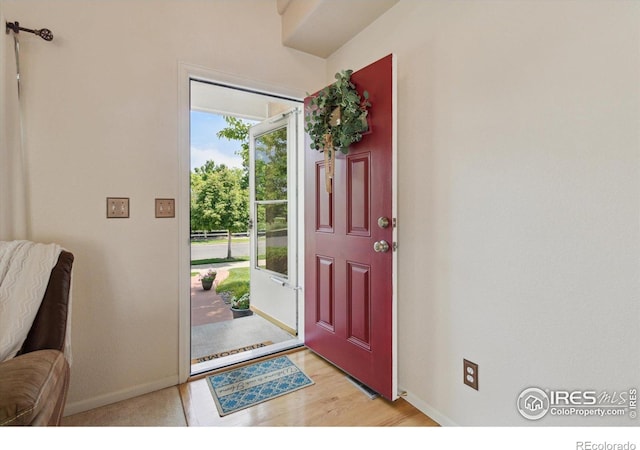 4725 Spyglass Dr, Broomfield, CO 80023 - entrance foyer featuring baseboards and light wood finished floors