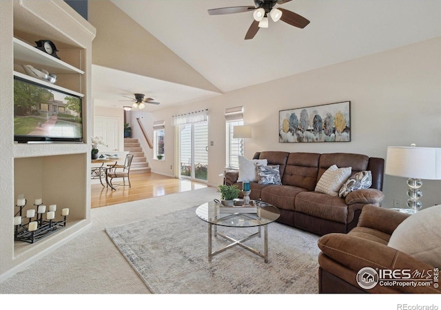 4725 Spyglass Dr, Broomfield, CO 80023 - living area featuring ceiling fan, stairway, carpet flooring, and high vaulted ceiling