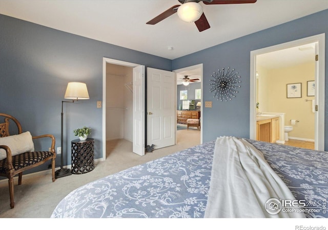 4725 Spyglass Dr, Broomfield, CO 80023 - bedroom with carpet, ensuite bath, a spacious closet, ceiling fan, and a closet