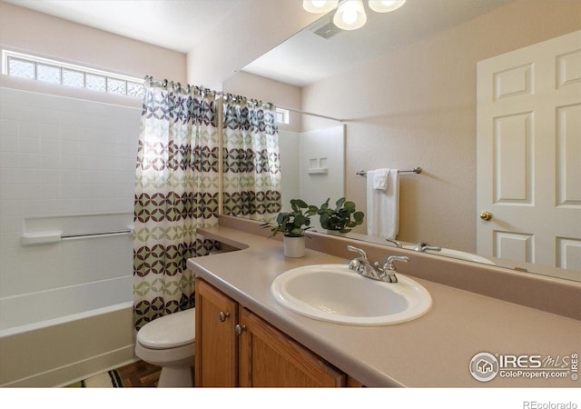 4725 Spyglass Dr, Broomfield, CO 80023 - bathroom with vanity, toilet, and shower / tub combo with curtain