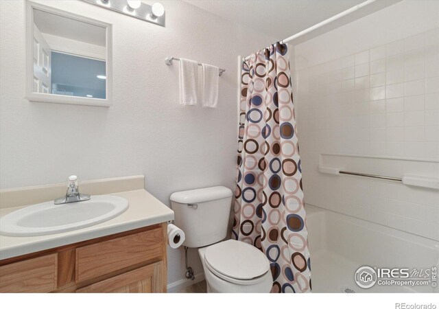 4725 Spyglass Dr, Broomfield, CO 80023 - bathroom with vanity, shower / bath combination with curtain, and toilet