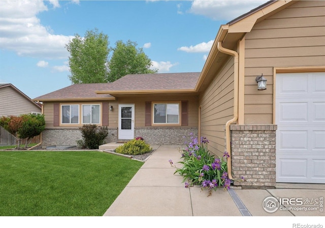 315 Laurel Ave, Eaton, CO 80615 - view of front of property featuring brick siding and a front lawn