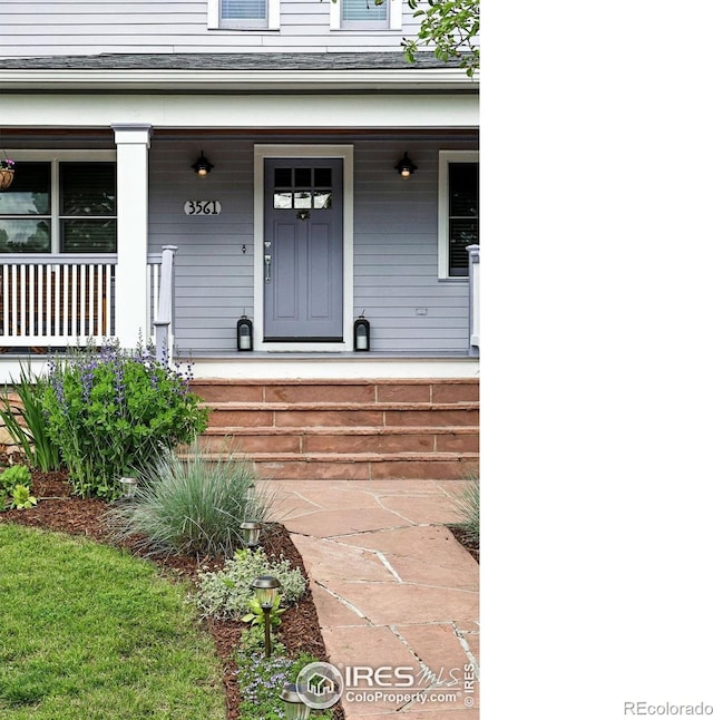 3561 4th St, Boulder, CO 80304 - doorway to property with covered porch and roof with shingles