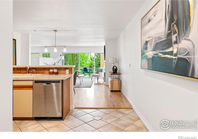 3805 Northbrook Dr Unit A, Boulder, CO 80304 - kitchen with dishwasher, tile countertops, a sink, open floor plan, and decorative light fixtures