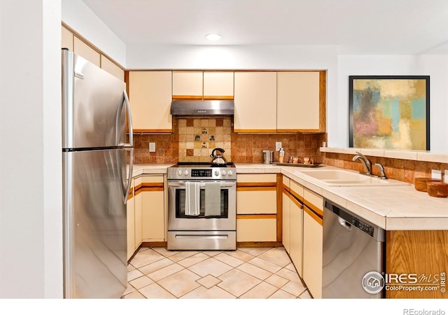 3805 Northbrook Dr Unit A, Boulder, CO 80304 - kitchen featuring stainless steel appliances, extractor fan, a sink, cream cabinetry, and recessed lighting