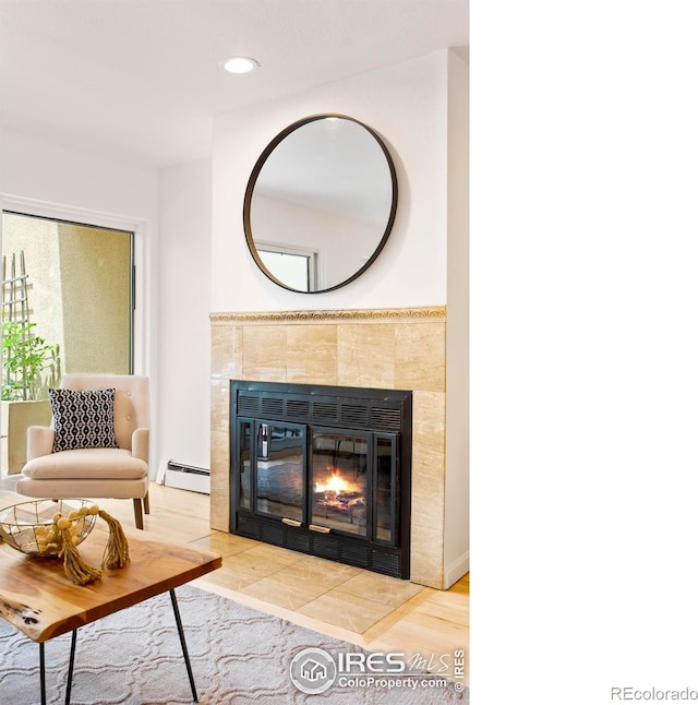 3805 Northbrook Dr Unit A, Boulder, CO 80304 - living room featuring a baseboard heating unit, a tiled fireplace, and recessed lighting
