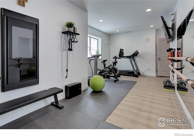 9527 Loveland Way, Arvada, CO 80007 - workout area with recessed lighting, baseboards, and wood finished floors