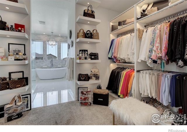 9527 Loveland Way, Arvada, CO 80007 - spacious closet with a chandelier