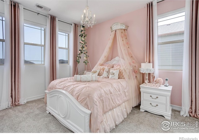 9527 Loveland Way, Arvada, CO 80007 - bedroom with light carpet, a chandelier, and baseboards