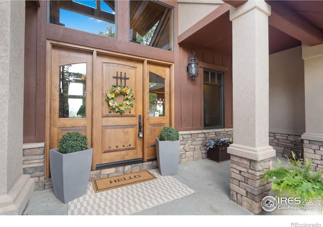 8236 County Road 74, Windsor, CO 80550 - doorway to property featuring stone siding