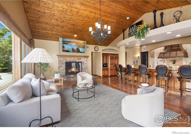 8236 County Road 74, Windsor, CO 80550 - living area with wooden ceiling, high vaulted ceiling, a chandelier, wood finished floors, and a fireplace