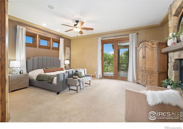 8236 County Road 74, Windsor, CO 80550 - bedroom with light carpet, access to exterior, a stone fireplace, ornamental molding, and a ceiling fan