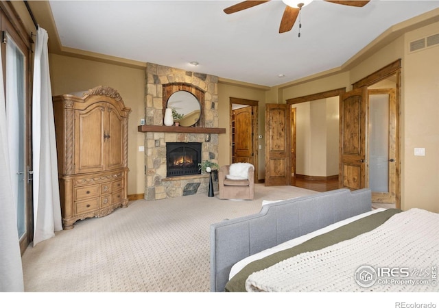 8236 County Road 74, Windsor, CO 80550 - carpeted bedroom with a fireplace and ceiling fan