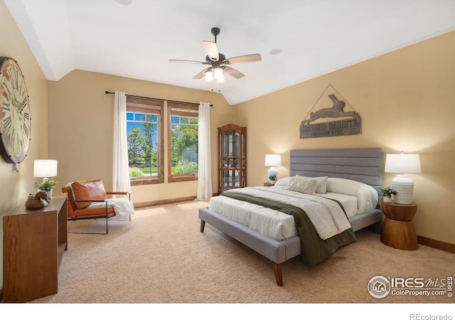 8236 County Road 74, Windsor, CO 80550 - bedroom with vaulted ceiling, carpet floors, baseboards, and ceiling fan