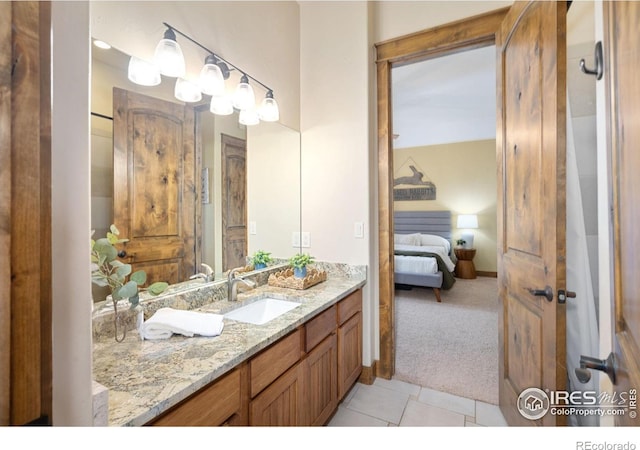 8236 County Road 74, Windsor, CO 80550 - bathroom featuring vanity, ensuite bath, and tile patterned flooring