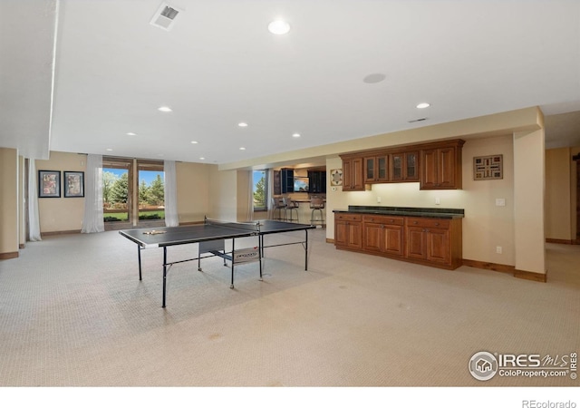 8236 County Road 74, Windsor, CO 80550 - rec room with light carpet, recessed lighting, bar with sink, and baseboards