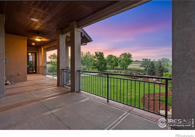 8236 County Road 74, Windsor, CO 80550 - patio terrace at dusk with a yard and a balcony