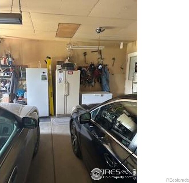 31888 County Road U, Brush, CO 80723 - garage with freestanding refrigerator