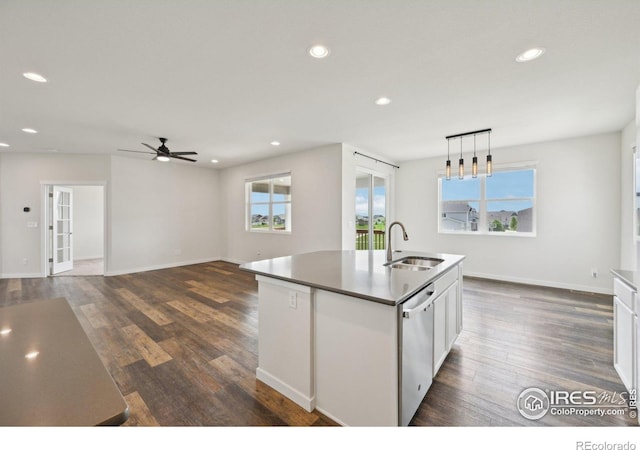 961 Mouflon Dr, Severance, CO 80550 - kitchen with a sink, stainless steel dishwasher, a ceiling fan, an island with sink, and recessed lighting