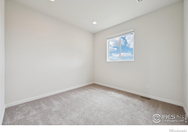 961 Mouflon Dr, Severance, CO 80550 - spare room featuring carpet, baseboards, and recessed lighting