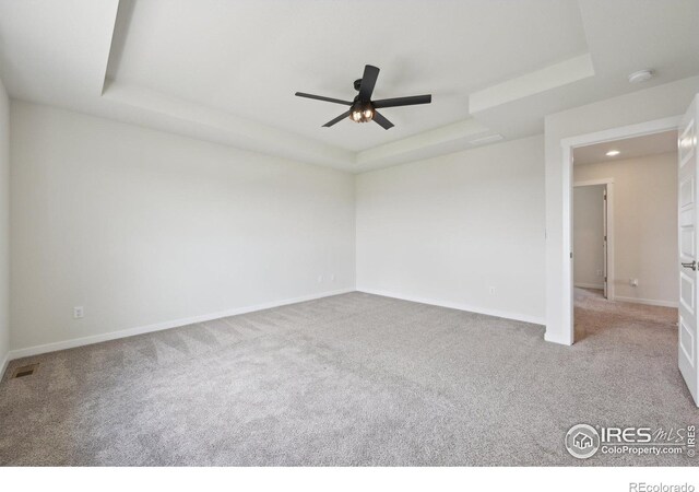 961 Mouflon Dr, Severance, CO 80550 - empty room with a tray ceiling, carpet floors, ceiling fan, and recessed lighting