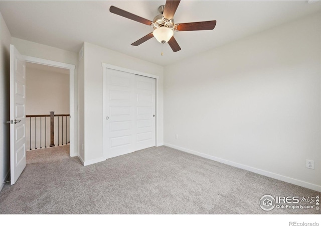 961 Mouflon Dr, Severance, CO 80550 - unfurnished bedroom featuring carpet flooring, a closet, baseboards, and a ceiling fan