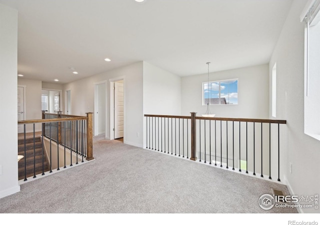 961 Mouflon Dr, Severance, CO 80550 - corridor with carpet floors, recessed lighting, baseboards, and an upstairs landing