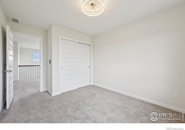 961 Mouflon Dr, Severance, CO 80550 - unfurnished bedroom with carpet flooring, baseboards, and a closet