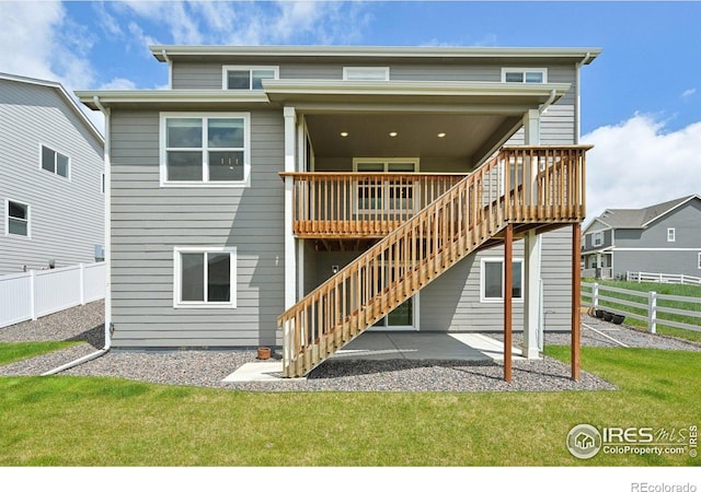 961 Mouflon Dr, Severance, CO 80550 - back of house with stairs, a deck, and a patio area