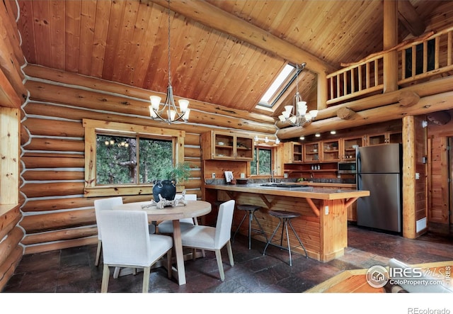 28 Ute Crossing Ct, Lyons, CO 80540 - dining space with wooden ceiling with exposed beams, high vaulted ceiling, a skylight, log walls, and a chandelier