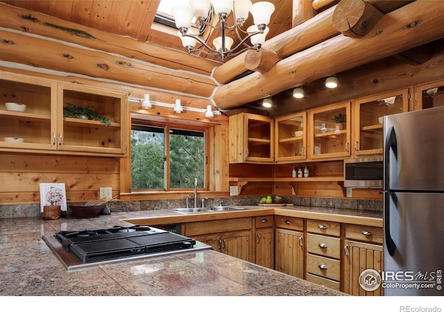 28 Ute Crossing Ct, Lyons, CO 80540 - kitchen featuring stainless steel appliances, tile countertops, brown cabinetry, a sink, and glass insert cabinets