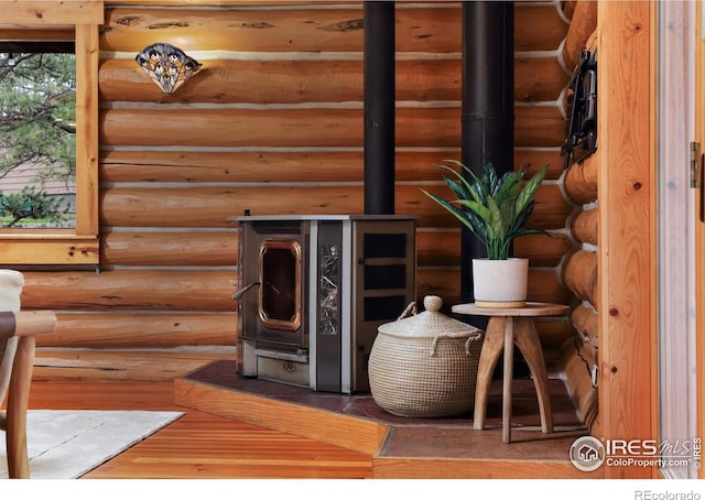 28 Ute Crossing Ct, Lyons, CO 80540 - detailed view of log walls and a wood stove